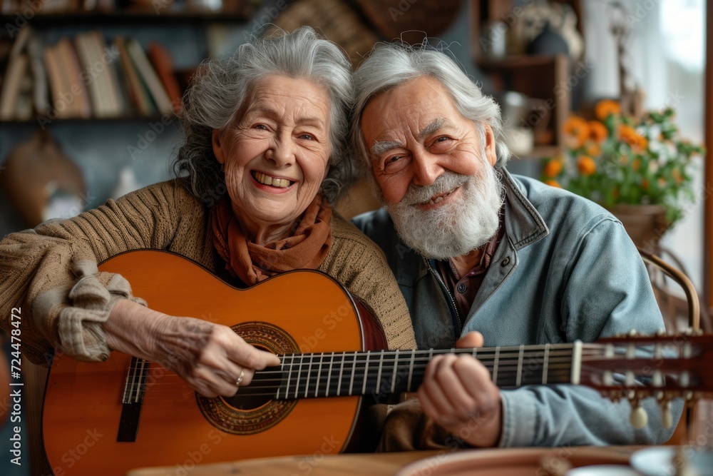Portrait of an elderly couple enjoying playing the guitar in their own home. They have a smiling and happy face. Portrait of an elderly couple enjoying playing the guitar in their own home. They have a smiling and happy face.