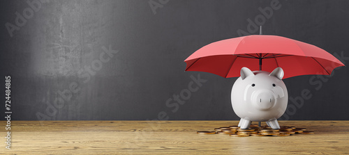 Creative image of pink piggy bank under blue umbrella on wide concrete wall background with mock up place and wooden flooring. 3D Rendering. photo