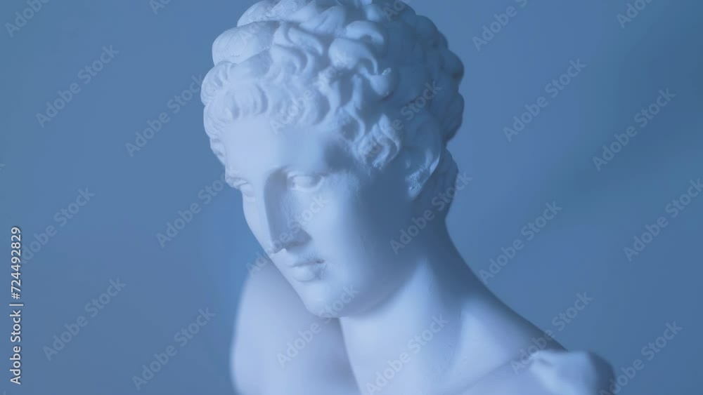 Rotating statue of the Greek God Apollo in warm light Rotating statue of the Greek God Apollo in warm light