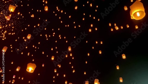 Flying lanterns in night sky in Loy Krathong festival, Chiangmai, Thailand
