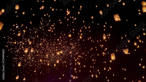 Flying lanterns in night sky in Loy Krathong festival, Chiangmai, Thailand