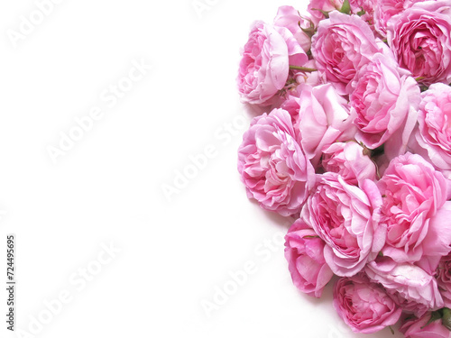 White background with pink roses on the side