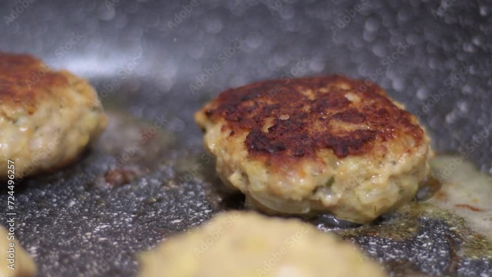 Close-up of homemade cutlets being fried in a frying pan. Cooking beef and pork with oil. Close-up of homemade cutlets being fried in a frying pan. Cooking beef and pork with oil.