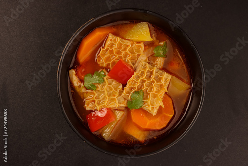 Fototapeta Naklejka Na Ścianę i Meble -  Dominican Style Mondongo is a Warm Comforting Stew Made with Beef Tripe, Carrots and Potatoes in Tomato Sauce.