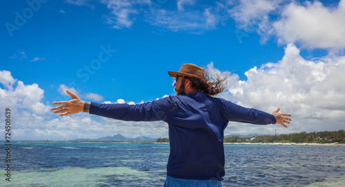 Man Standing on Boat in the Ocean