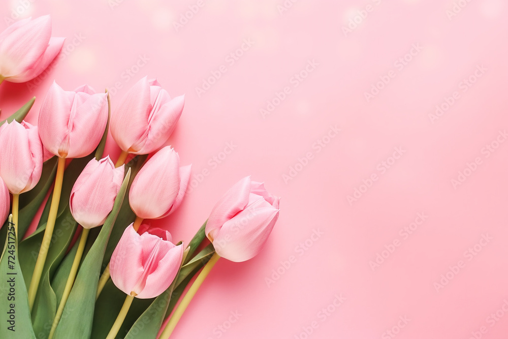 Spring tulips flowers on pink background. Top view Spring tulips flowers on pink background. Top view