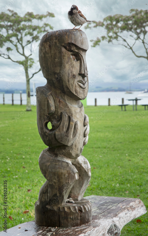 Woodcarving. Wooden Maori pole at Kawhia New Zealand. Woodcarving. Wooden Maori pole at Kawhia New Zealand.