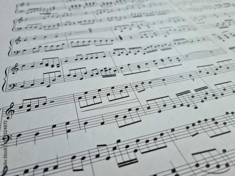 White paper with musical notes closeup background White paper with musical notes closeup background
