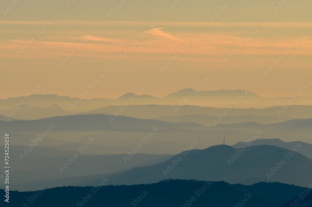 Sunrise Over Layered Mountains