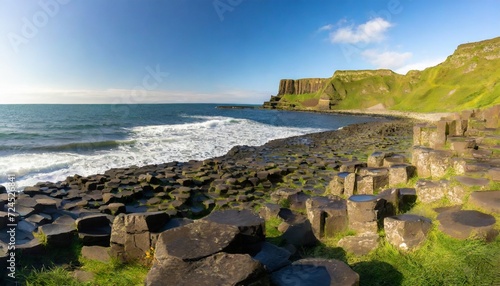 the giant s causeway at dawn on a sunny day with the famous basalt columns the result of an ancient volcanic eruption county antrim on the north coast of northern ireland uk photo