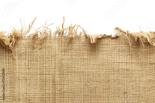 Burlap texture. A piece of torn burlap on a white background. photo