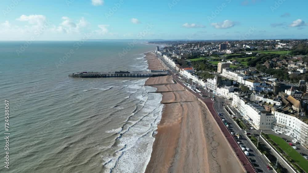 Aerial drone shot of Hastings UK, pull away shot of Hastings Beach, Hastings Pier and coast line. ENGLAND UK 4K DRONE AERIALS Aerial drone shot of Hastings UK, pull away shot of Hastings Beach, Hastings Pier and coast line. ENGLAND UK 4K DRONE AERIALS