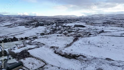 Aerial view of snow covered Bunaninver and Lackagh by Portnoo in County Donegal, Ireland. photo
