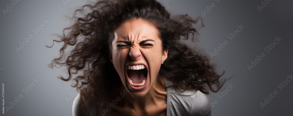 Angry young woman screaming. Anger expression concept