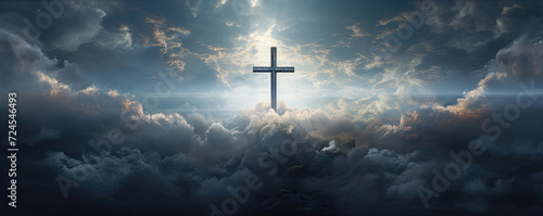 cross in clouds symbol of the death and resurrection , copy space for text. photo