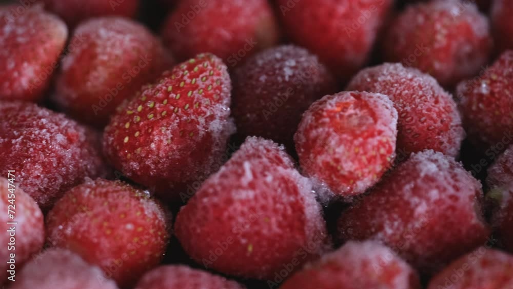 A plate with a frozen strawberries on it. A plate with a frozen strawberries on it.