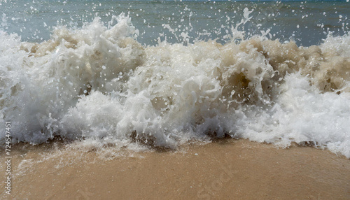  hard wave water hit sand in close up at beach © fasha