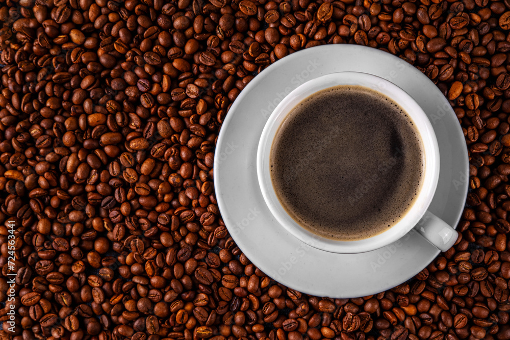 Black espresso coffee cup with croissant and coffee beans, simple traditional french breakfast Black espresso coffee cup with croissant and coffee beans, simple traditional french breakfast