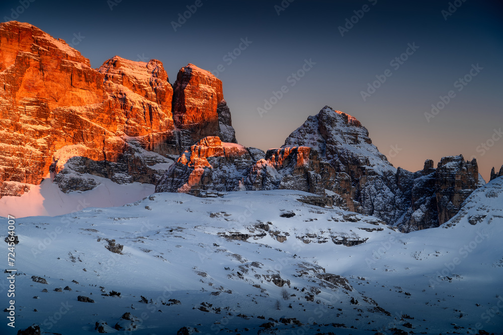 Golden rays of the sun illuminating the high peaks of the Dolomites. Image of Italian Dolomites during the winter. Amazing light in Dolomites Unesco.