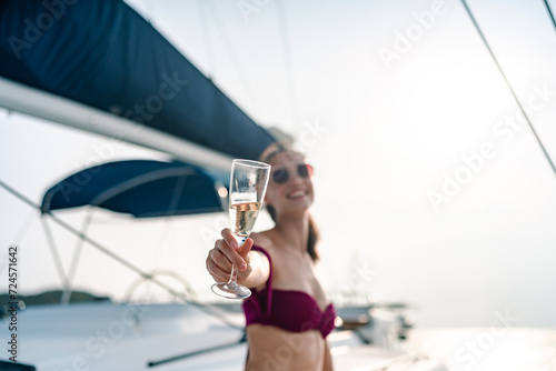 Young woman drink a champag...
