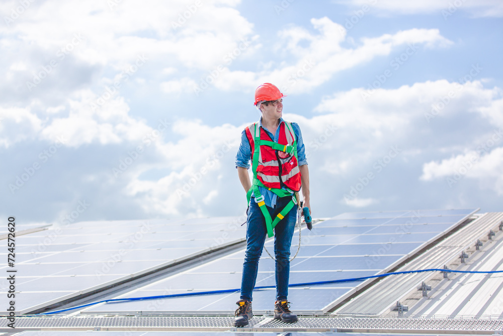 A Professional engineer or expert technician using radio communication or walkie-talkie to order work, control, report problem or explain situation in photovoltaic solar panel farm renewable energy. A Professional engineer or expert technician using radio communication or walkie-talkie to order work, control, report problem or explain situation in photovoltaic solar panel farm renewable energy.