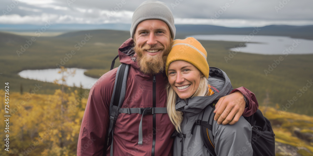 A young couple enjoys their autumn hike in Lapland