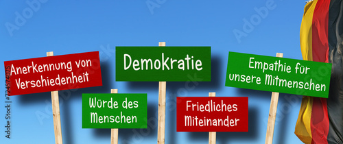 Demokratieschilder mit deutscher Flagge im Hintergrund photo