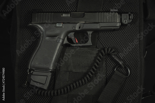 Tactical pistol g19 with muzzle brake and safety cord.