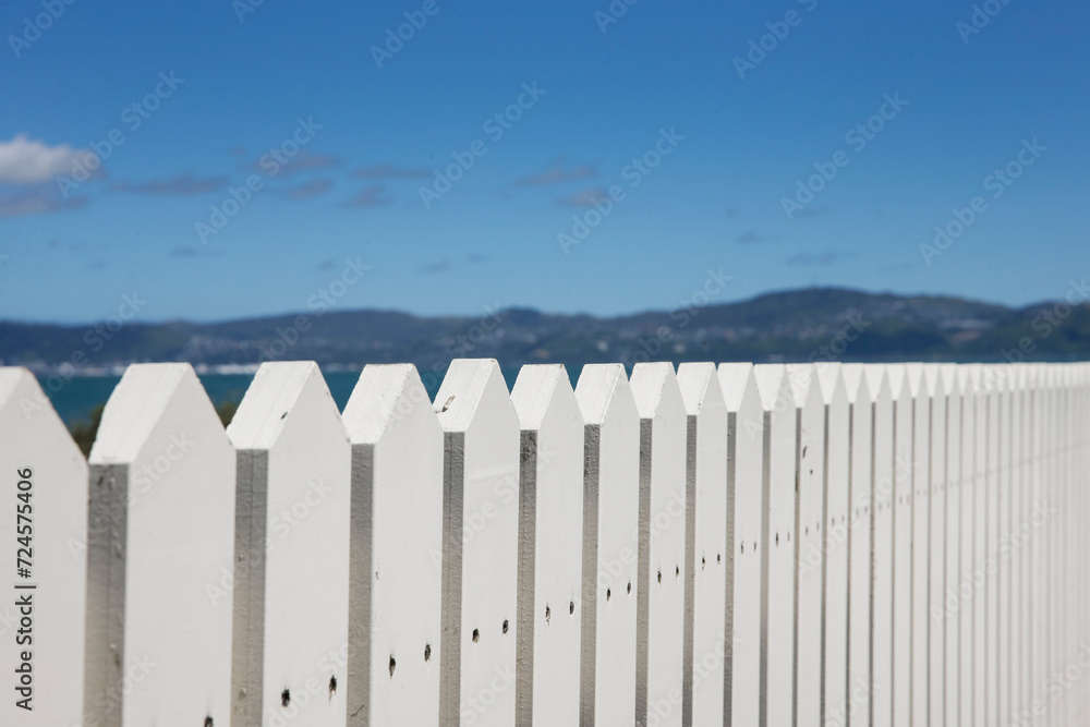 Pier. Wooden jetty. White fence. Eastbourne New Zealand. Wellington Harbour. Coast. Rona Bay wharf.