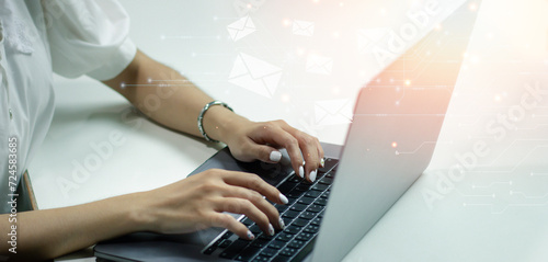 Hand of businesswoman using computer laptop with Email marketing and newsletter concept. Contact us by newsletter email and protect your personal information from spam mail concept.