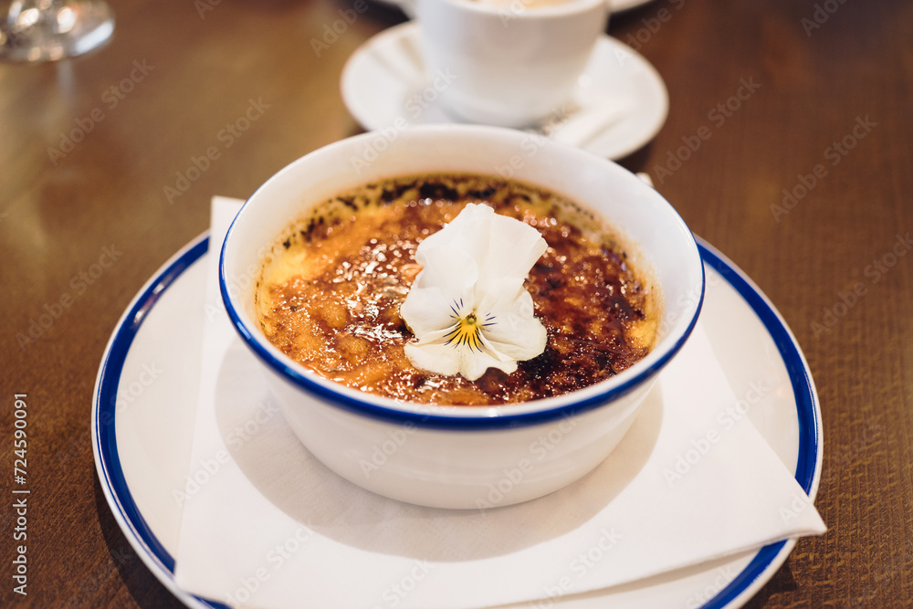 Traditional French pastry Crème brûlée is a smooth and creamy custard topped with crisp, caramelized sugar Traditional French pastry Crème brûlée is a smooth and creamy custard topped with crisp, caramelized sugar