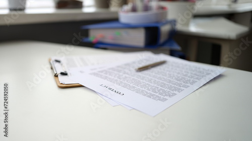 Ballpoint pen lying on documents with contract closeup. Employment under contract concept