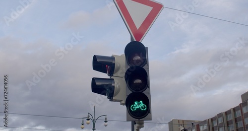 Urban Green Traffic Light: Eco-Friendly Cityscape with Bicycle Icon. Sustainable and environmentally conscious commuting. Green traffic light serves as a symbol urban life, sustainable practices.