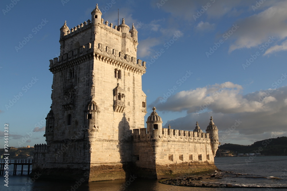 Belem tower and wooden pier during day in Lisbon, Portugal