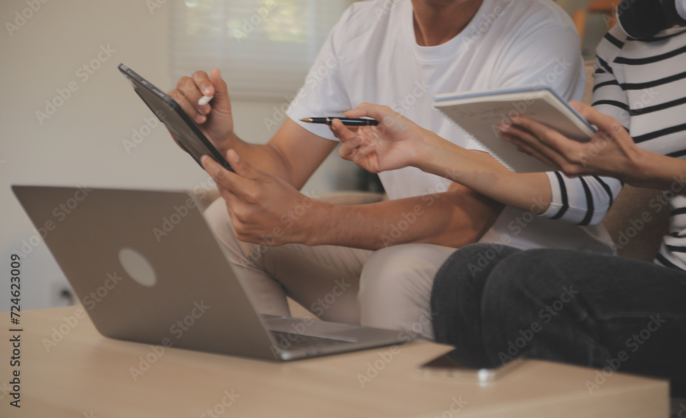 Naklejka premium Asian business people discussing team of young asian entrepreneurs discussing business, Asia business team meeting discussion talking.