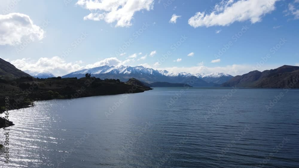 Aerial view of Lake Wanaka, the fourth-largest in New Zealand and known for its clear blue waters and picturesque landscapes.