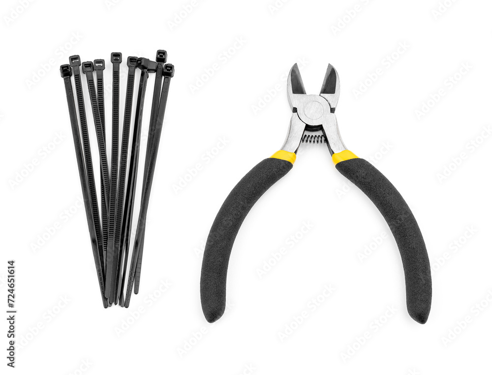 Yellow side cutters on a white background. Side cutting tool.
Yellow side cutters on a white background. Side cutting tool.