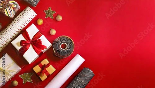 banner with christmas gift boxes velvet ribbons rolls of wrapping paper and decorations on red background