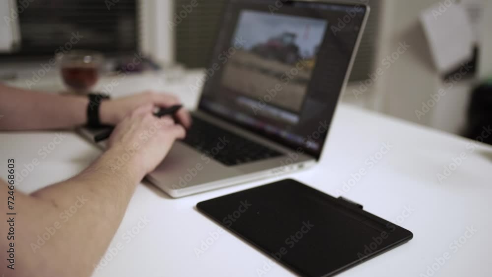 Photographer working on laptop on the table. Editing photograph Photographer working on laptop on the table. Editing photograph