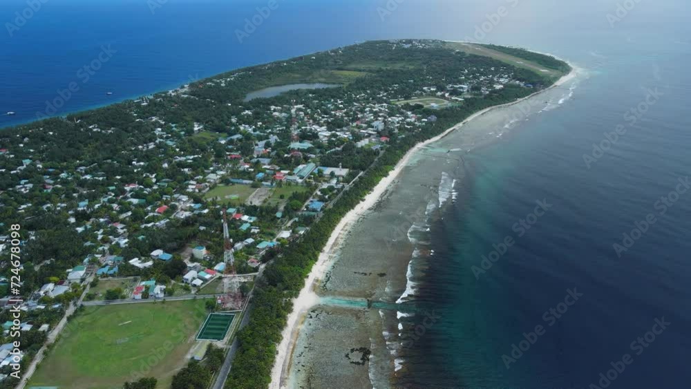 Maldives islands coastline, ocean and tropical beach with palms. Aerial view Maldives islands coastline, ocean and tropical beach with palms. Aerial view