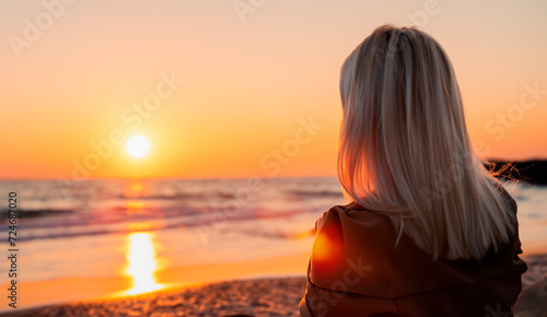 a woman watching a sunset on a torpical beach generated with artificial intelligence