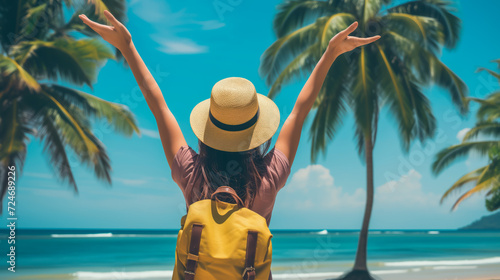 Woman with raised arms at tropical beach, summer vacation travel wallpaper.