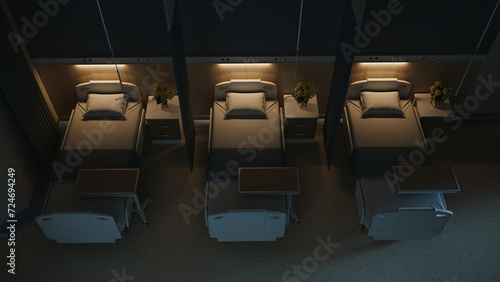 Esthetic and clean modern hospital patient room, at night. Private clinic comfortable recovery place for patient treatment. Hospital ward interior.