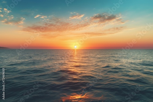 A peaceful sunset over a calm ocean © Gogi