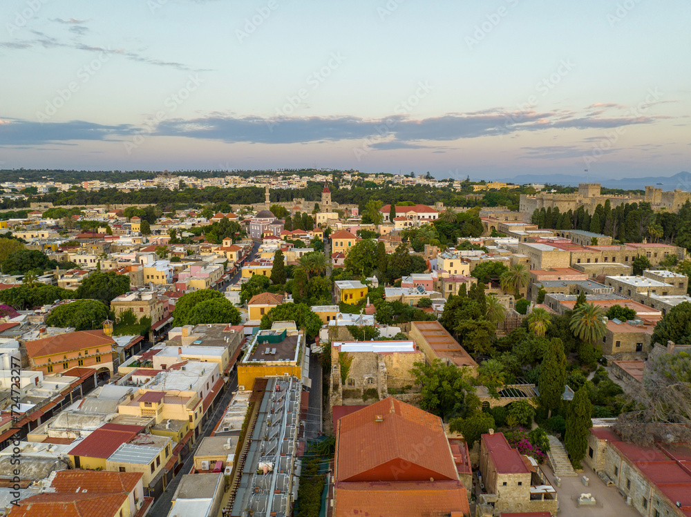 Obraz premium Rhodes old town houses, Mosque of Suleiman and surrounding fortifications at sunrise, Greece, Aerial view