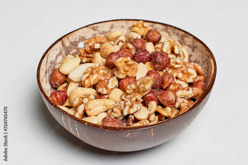mixed hazelnuts, cashew nuts and almonds in a bowl. mixed hazelnuts, cashew nuts and almonds in a bowl.