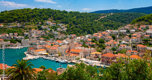 Puc  is  c  a village panorama on Brac island  Croatia. Mediterranean holiday destination with picturesque historic harbor fjord in summer with yachts  sailing boats. Idyllic atmosphere in adriatic sea.