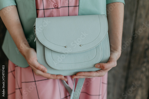 Wallpaper Mural girl holding a light green bag in her hands Torontodigital.ca