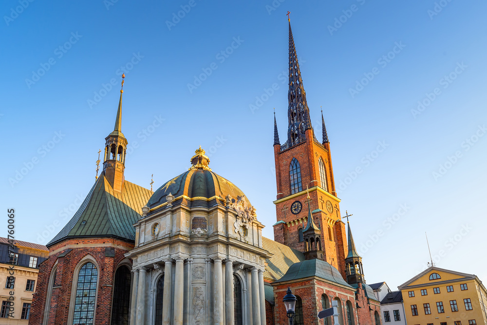 The Riddarholmen Church in Stockholm, Sweden. Cityscape of Stockholm, Sweden. Evening time and soft sunlight. A walk through the city