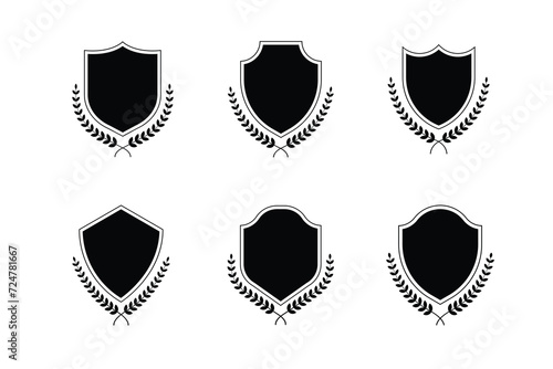 Medieval shields with laurel wreaths set. Trophy, awards, vintage insignia shields collection. Black color. Premium quality. Vector illustration isolated on white background photo